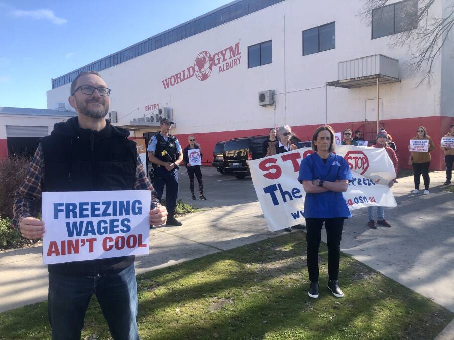 UNITED: Albury intensive care paramedic Grahame Dann was supported by nurses, midwives and police officers at the protest in Albury calling for the government to scrap the wage freeze for public servants.
