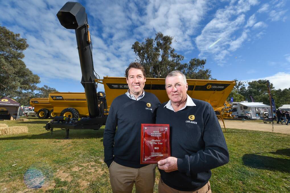 FATHER SON: Heath and Bruce Hutcheon with the 2019 Henty Machine of the Year the Coolamon Spreader Chaser. Picture: MARK JESSER