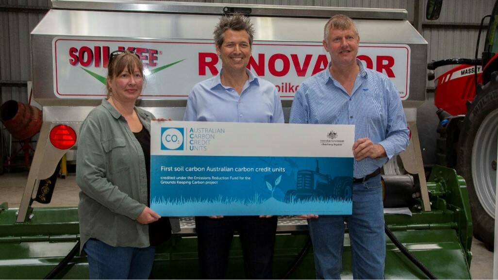 Matthew Warnken (middle) presents Marja Olsen and Niels Olsen with the first soil carbon credits in Australia in March. A $20,000 incentive is now up for grabs for farmers who match the Olsen's achievement.