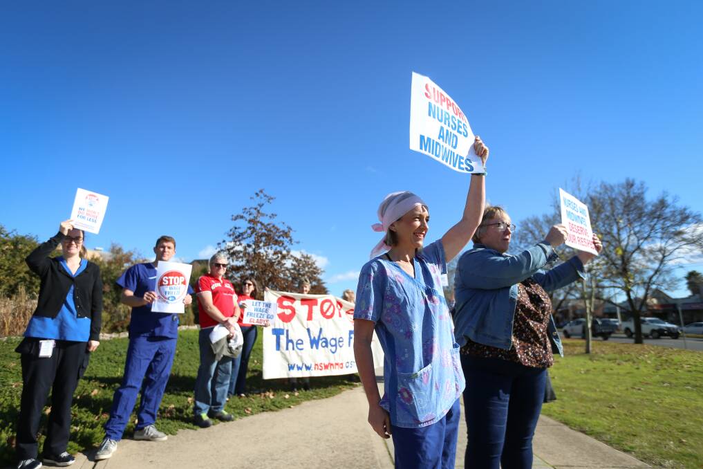 APPALLED: Albury nurses Charlotte Todros and Gillian Greene lead the protest outside Albury Base Hospital on Wednesday. Picture: JAMES WILTSHIRE