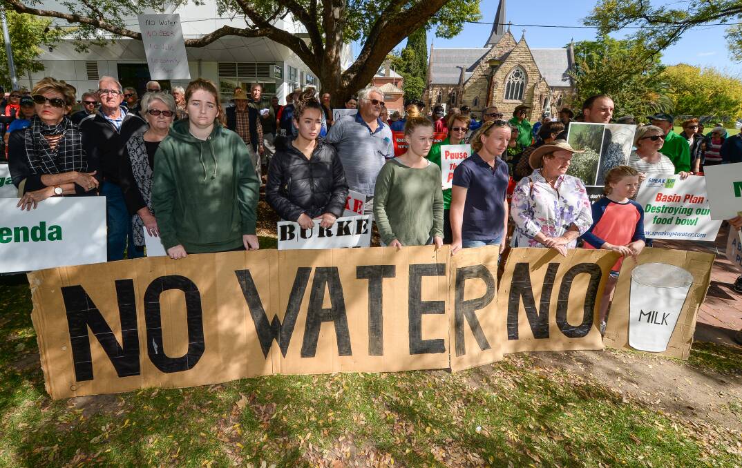 STANDING TALL: Front and centre during the rally was this 'no water no milk' sign.