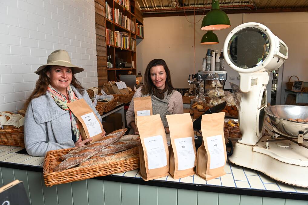 LOCAL PRODUCT: Clear Creek Pastoral Co's Ange Murphy with Milawa Bread's Flo Desoutter with the locally milled flour for sale locally. Picture: MARK JESSER