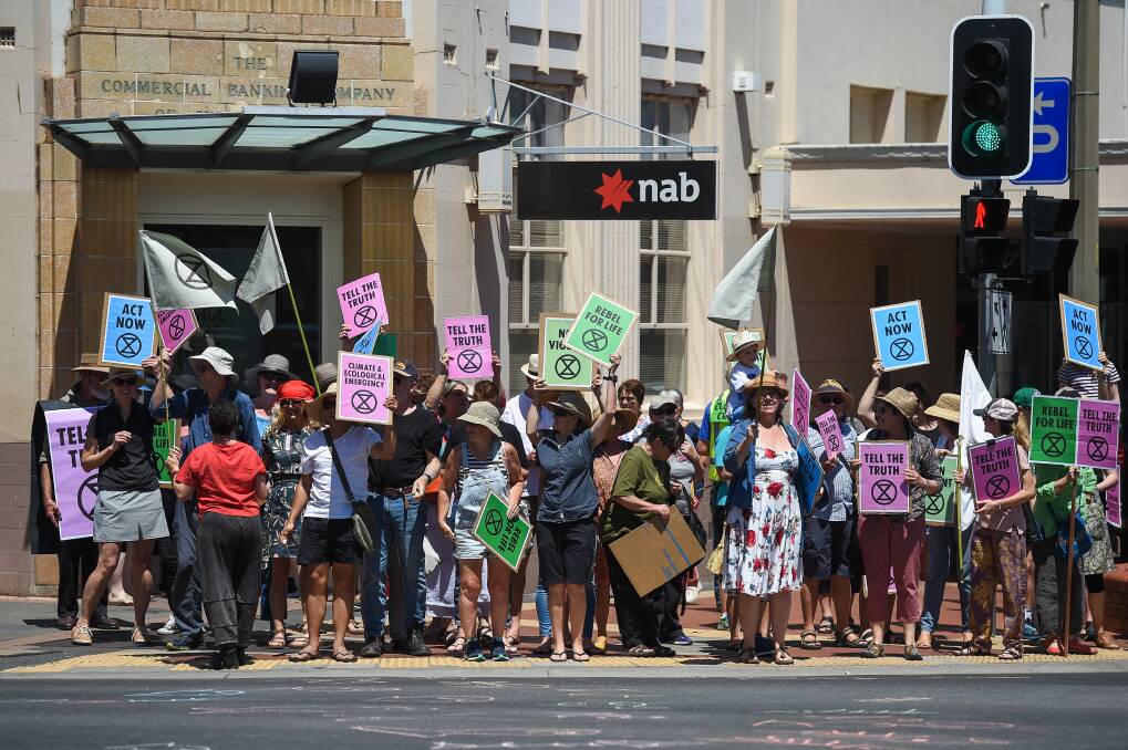 FRONT AND CENTRE: Around 120 protesters took to the main intersection in Albury on December 15. Picture: MARK JESSER