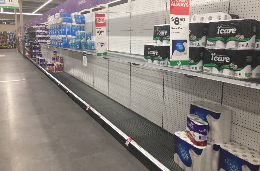 ALMOST GONE: Shelves at Woolworths Wodonga were nearly empty on Wednesday afternoon with panic-buyers clearing out the toilet paper aisle.