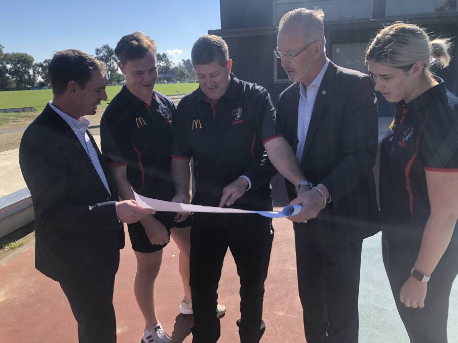 BIG PLANS: Wodonga Raiders club members with Steve Martin and Mark Byatt inspected the plans to upgrade Birallee Park.