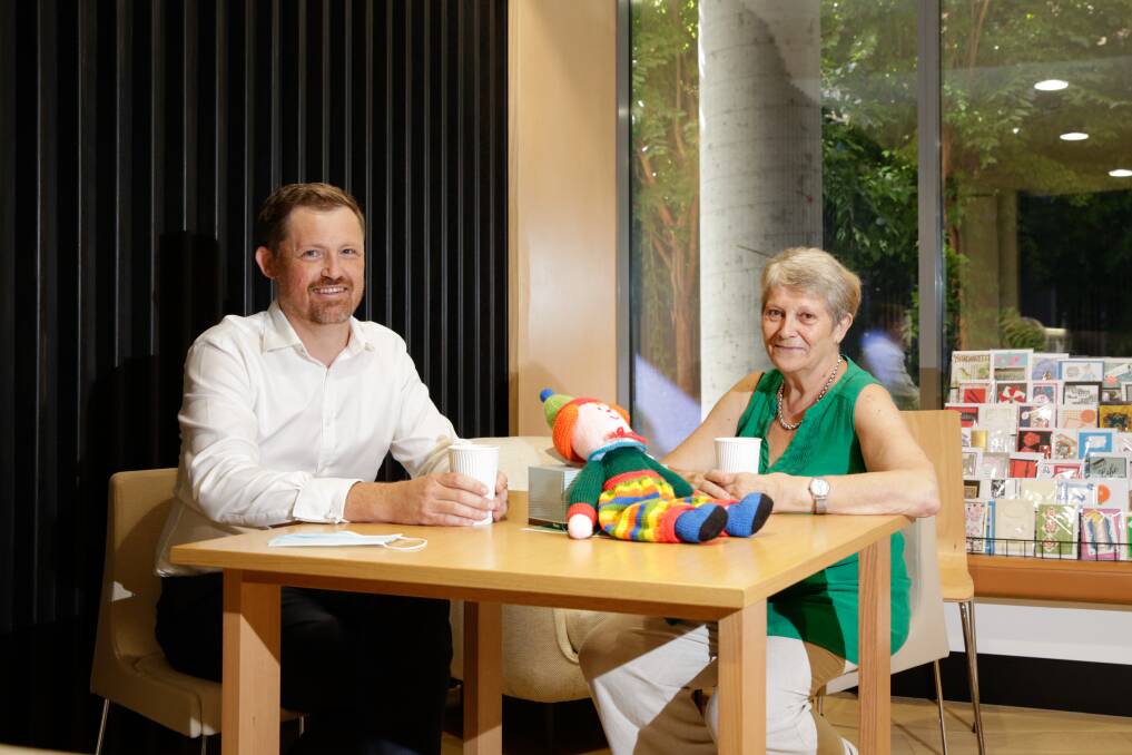 WORLD OF DIFFERENCE: Albury Wodonga Regional Cancer Centre wellness centre's new coordinator Ben Engel enjoys a coffee with patient Paule Gauquie. Picture: JAMES WILTSHIRE
