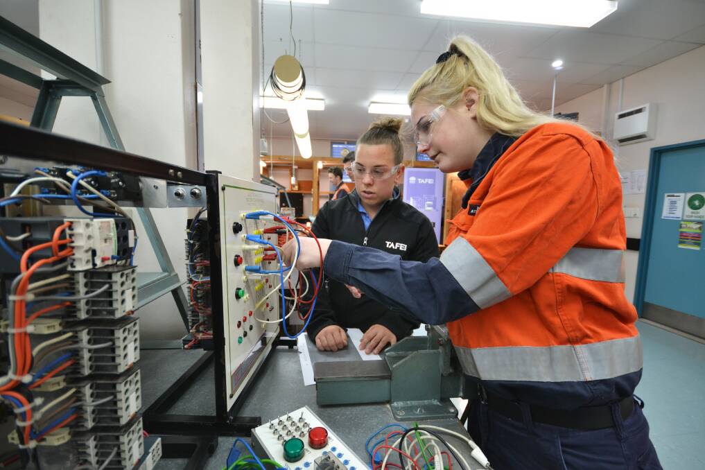 HANDS ON: TAFE NSW Electrotechnology Certificate III student Paige Allan with teacher Leonie Davies at InfoFest last year. The 2020 event runs from January 21 to 23.