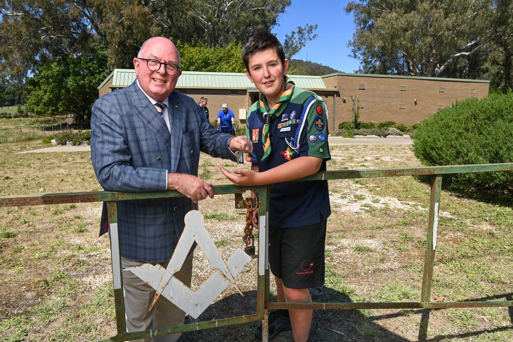 NEW HOME: Grand Master of Freemasons Victoria Richard Elkington hands over the keys to Myrtleford Scout Alex Cameron, 13. Pictures: MARK JESSER