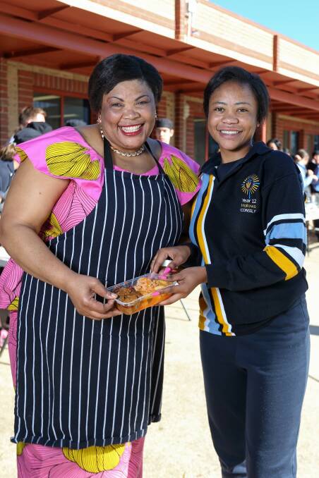 MOTHER AND DAUGHTER: Concilie Bashimbe was proud to have her mother Annie cook traditional Congolese food at Catholic College. Picture: TARA TREWHELLA