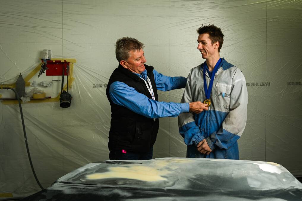 PROUD: Albury Auto Body Repairs apprentice Jaymes Smith with GOTAFE automotive coordinator Mark Ward