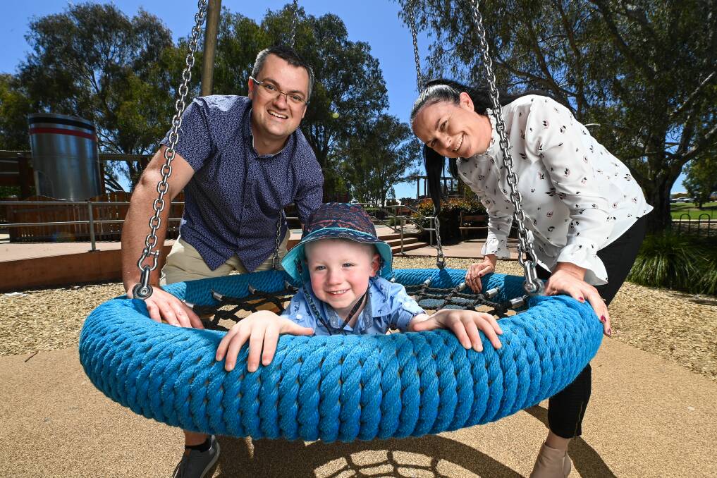 NEW SERVICE: Father-of-five Kevin Poulton said any help a new father can get goes a long way in preparing them for fatherhood. He is pictured with son Leo, 2, and MLHD's Melissa Smead. Picture: MARK JESSER