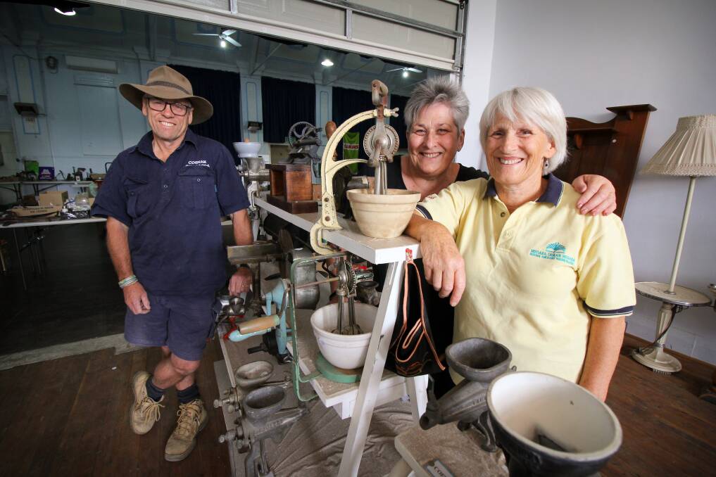 SIBLINGS: Stuart Lee, Elizabeth Browne and Robyn Moore with antiques collected by their father Jack which will be auctioned off on Sunday. Picture: MATTHEW SMITHWICK 
