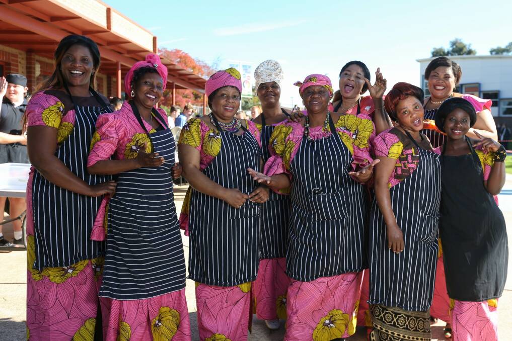 FAMILY: Congolese women celebrated Cultural Diversity Week at Catholic College by cooking traditional food. Picture: TARA TREWHELLA