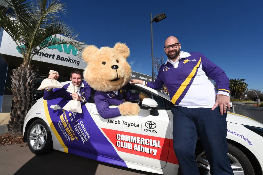 READY: WAW's Michael Mack, Stan Vyce (in Dougal Bear) and Paul Vaccaro with the major prize for Relay For Life. Picture: MARK JESSER