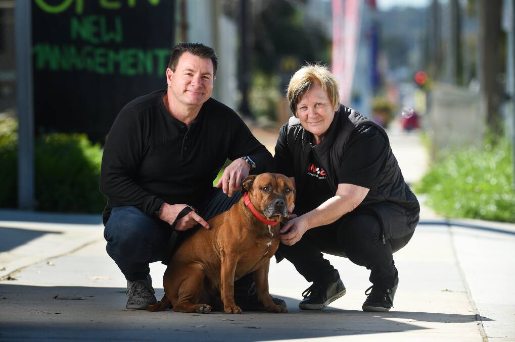 LIFE SAVED: Mark Gruber and Albury-Wodonga Animal Rescue's Ella Bloomfield with Rusty who is available for adoption. Picture: MARK JESSER