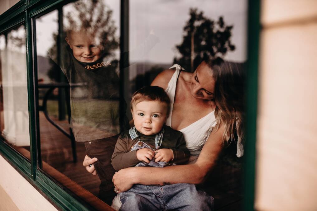 MUM OF TWO: Ash Henderson with sons Mac and Lex Henderson are one of more than 30 families taking part in the window sessions. Picture: MEG GIBBS PHOTOGRAPHY
