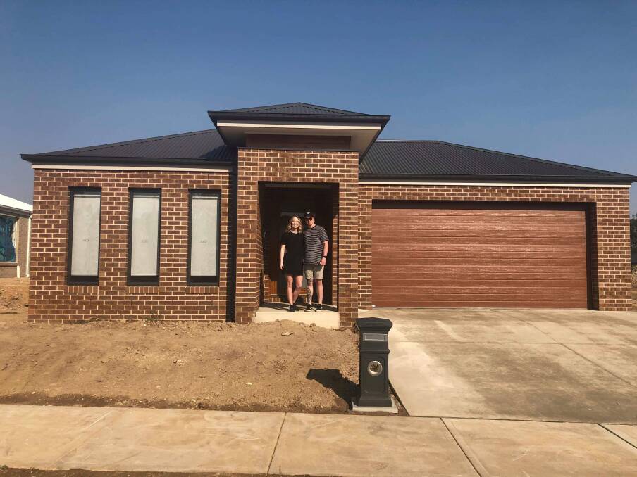 KEYS IN HAND: First home buyers Leah Gabriel and Douglas Fox said it was the perfect time for them to build their dream home. 
