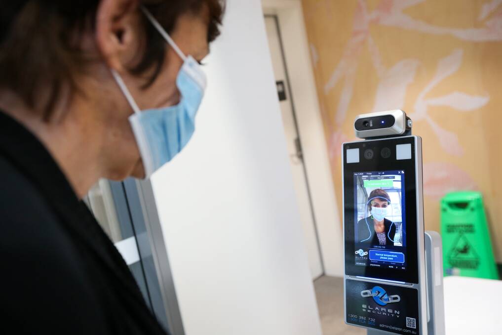 IN ACTION: The new high-tech devices check patients temperatures on arrival at the cancer centre and Albury emergency department. Trust fund chair Michelle Hensel demonstrates the new techology. Picture: JAMES WILTSHIRE