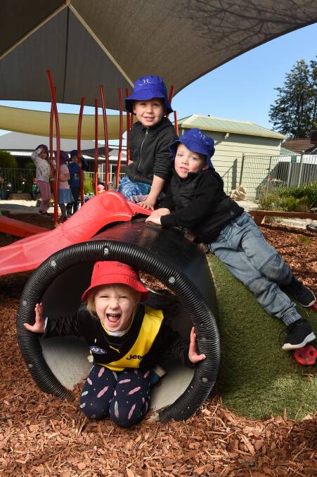 NEW FACILITIES: Grace Ellis, 5, Fletcher Trollope, 4 and Zac Jones, 4 enjoy the new play equipment at Yarrunga Early Learning Centre. Picture: MARK JESSER