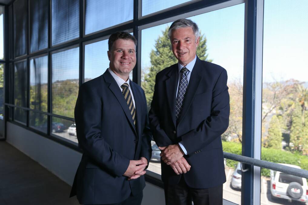 TEAM EFFORT: Albury MP Justin Clancy with his predecessor Greg Aplin who helped see the new Brain and Mind Centre open.