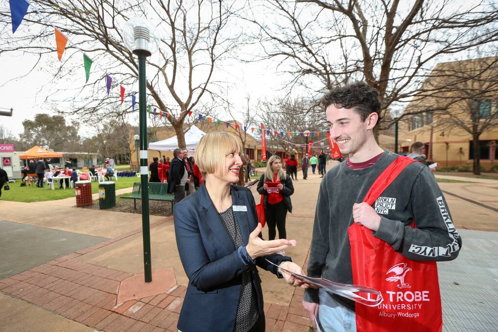 ASKING QUESTIONS: Dr Susan Furness speaks to student Lachlan Murray at La Trobe's open day.
