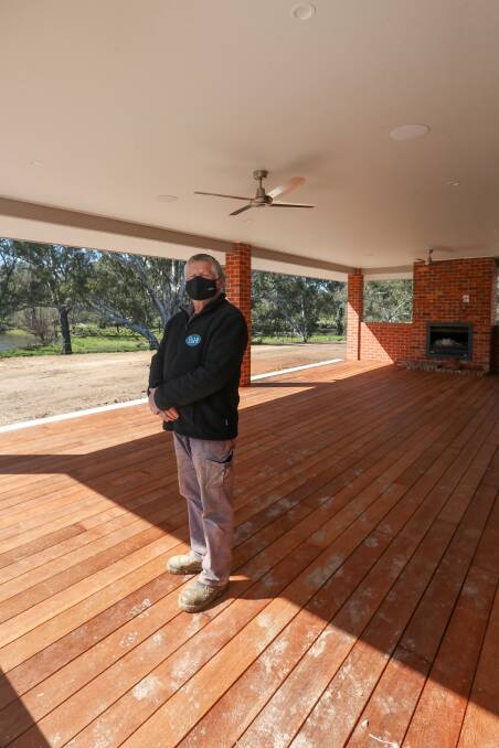 ENTERTAINING: Site supervisor Mick Glabbatz at the off-grid home in Staghorn Flat.