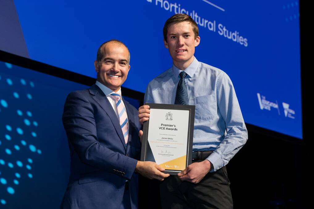 HARD WORK PAYS OFF: Victorian Education Minister James Merlino presents Rutherglen High School student James White with a Premier's VCE Award. 