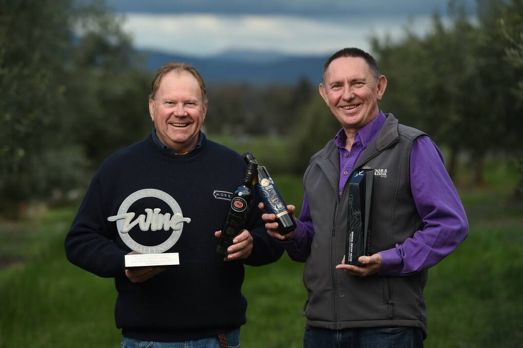 CHEERS: David Morris from Morris Wines and Rob Whyte from Gooramadda Olives celebrate their combined international success. Picture: MARK JESSER