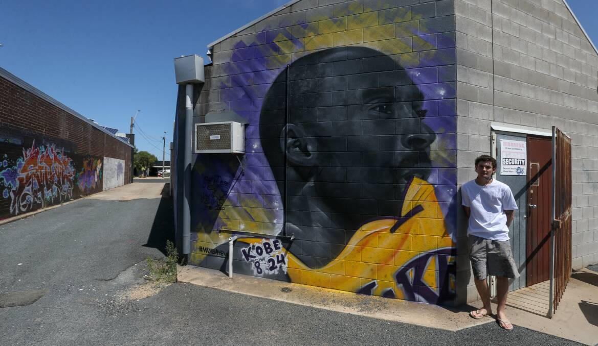 TRIBUTE: Border artist Kade Fielder dedicated the the mural in a laneway off Wagga Road, Lavington to Kobe Bryant. Picture: TARA TREWHELLA