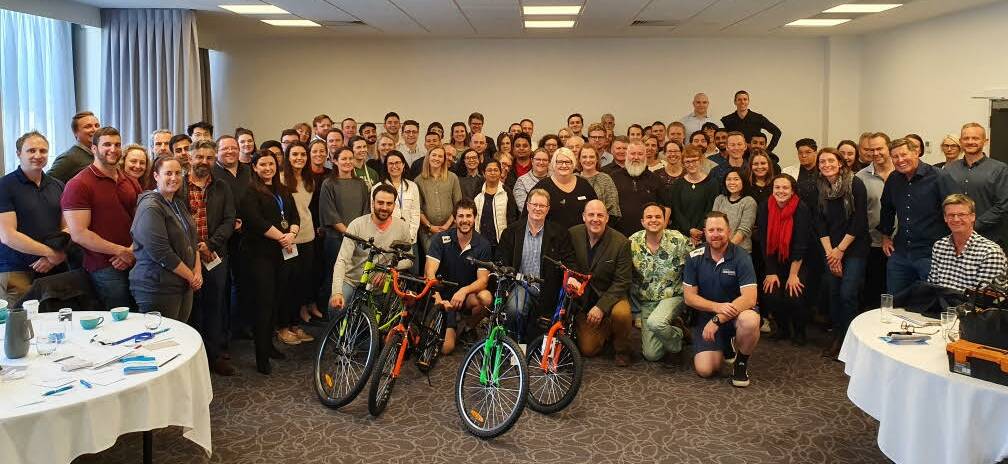 TEAM BONDING: The Apis Group assembled the bikes during a workshop with Corporate Challenge Australia.