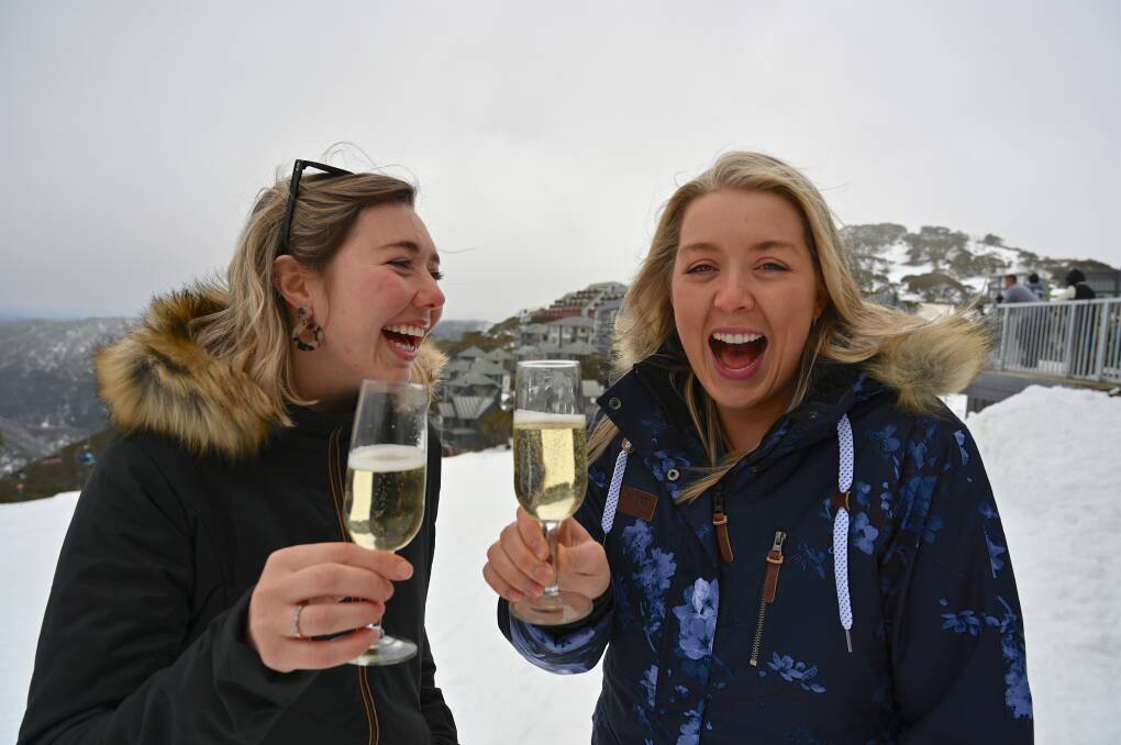 CHEERS: Katey Page and Kate Shillabeer toast the 2019 snow season at Hotham. Picture: CHRIS HOCKING
