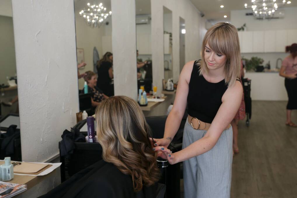 IN ACTION: Hairdresser Carly Vague was one of nine who came together on Sunday for the fundraiser. Picture: TARA TREWHELLA