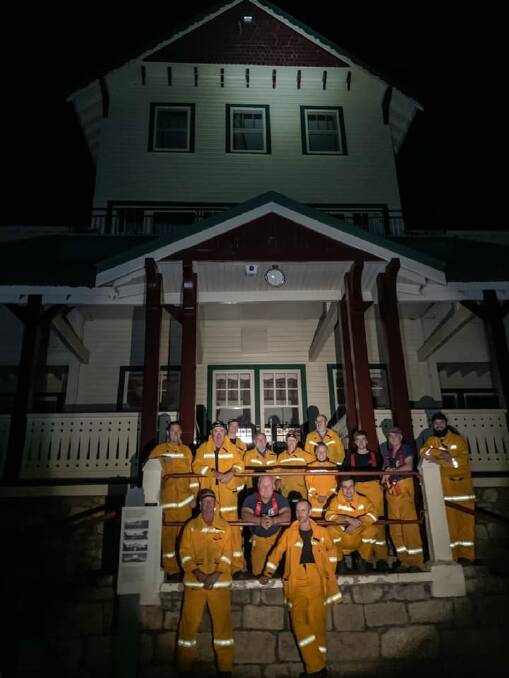 AT THE READY: Volunteer firefighters have been deployed to the Mount Buffalo Chalet "just in case" fire threatens the historical building. Pictures: MARC BONGERS
