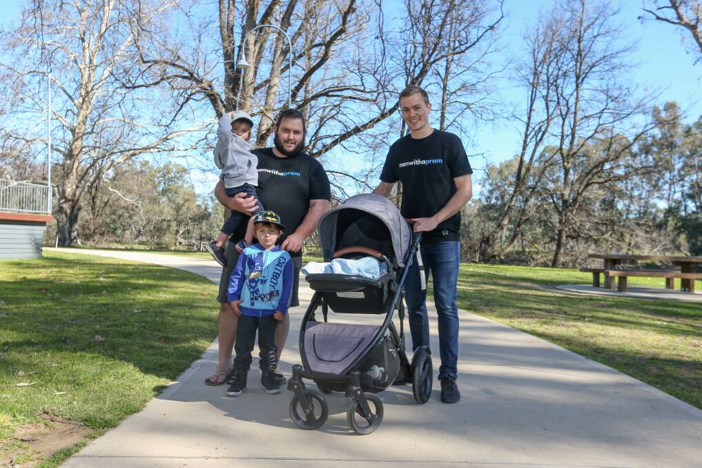 MATES: Daryl Taylor with his sons Ben and Brett and Josh Docking with son Isaac gear up for the Man With a Pram event. Picture: TARA TREWHELLA