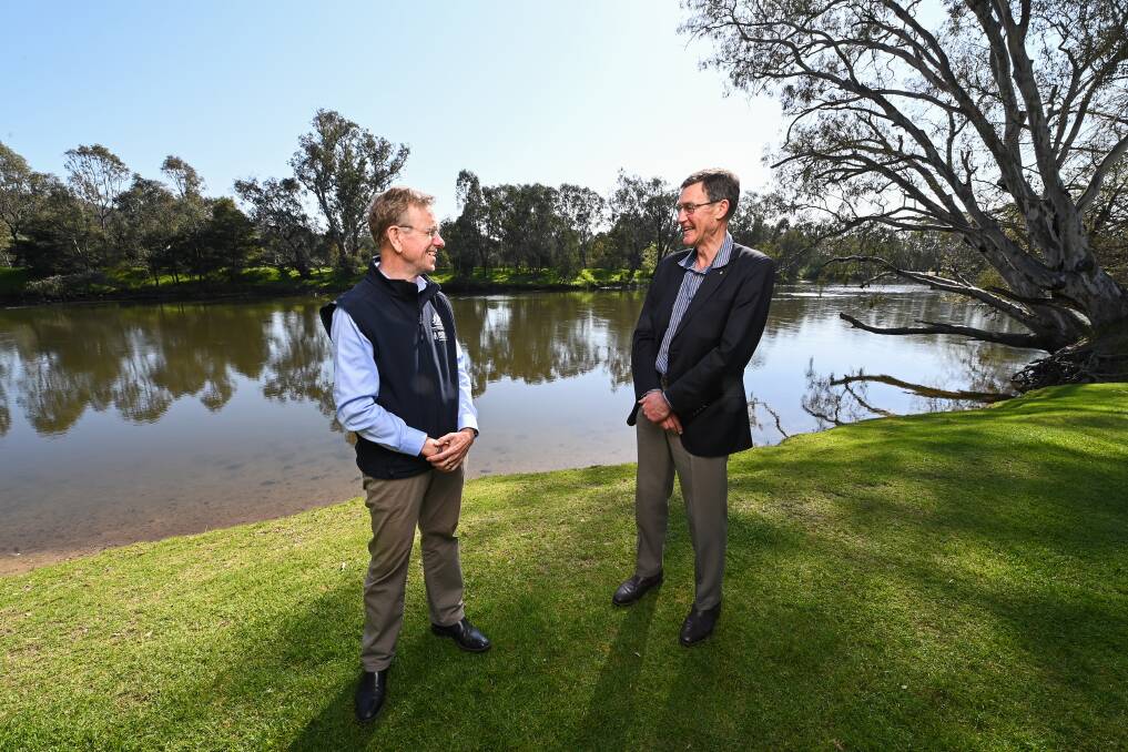 POSITIVE VISIT: Murray-Darling Basin Authority chief executive Phillip Glyde with new MDBA chair Sir Angus Houston on the banks of the Murray river in Albury. Picture: MARK JESSER