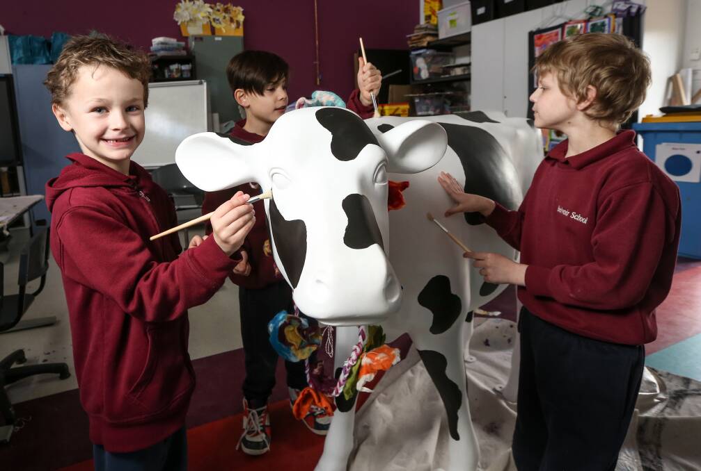 MISS DAISY: Belvoir Special School junior students Christian Wallace, Jackson Hodgkin and Jasper Voll with Daisy. Picture: JAMES WILTSHIRE