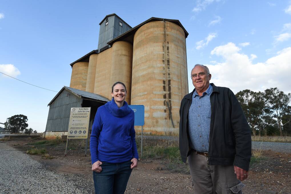 TOWN PROJECT: Rand Town Improvement projects will receive $65,000 which could be spent on silo art behind Sara Kreutzberger and Alistair McLeod. Picture: MARK JESSER