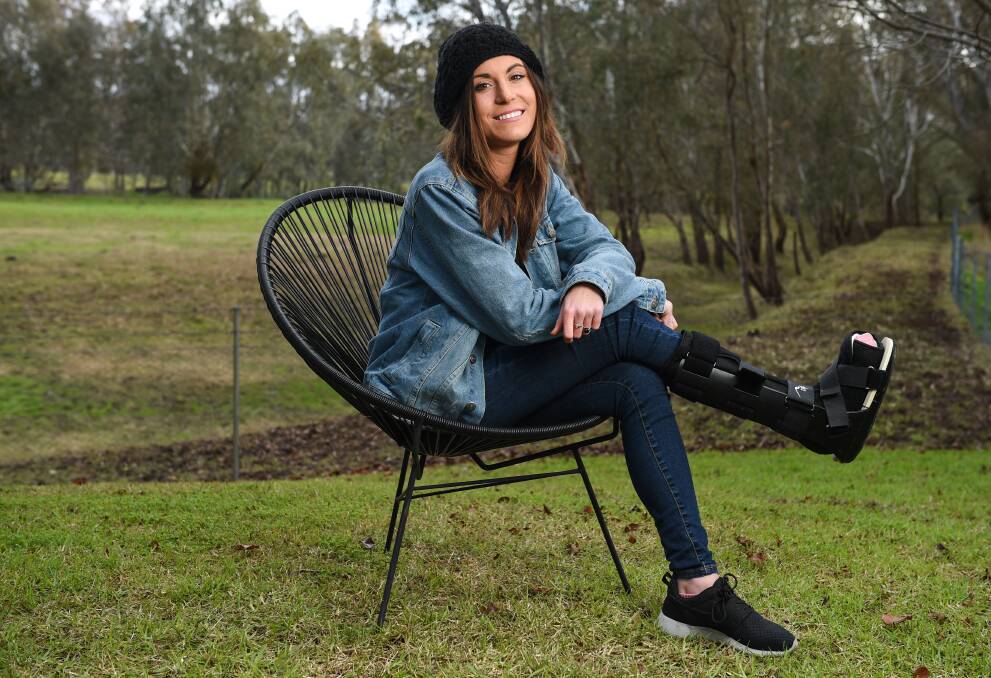 KEEP ON FIGHTING: Emily Wornes in Albury six months after her accident in Peru in 2015. She is now learning to walk for the second time after her 13th surgery left her with nerve damage. Picture: MARK JESSER