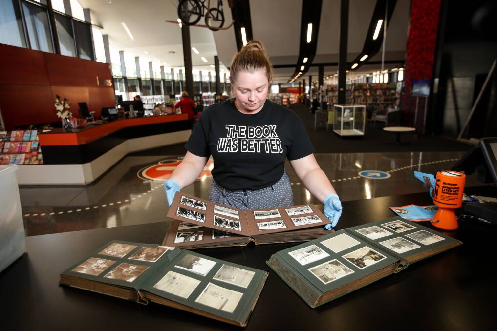 DONATION: Albury Library Museum's Emma Williams with the photo albums donated by Charles Reis. Picture: JAMES WILTSHIRE
