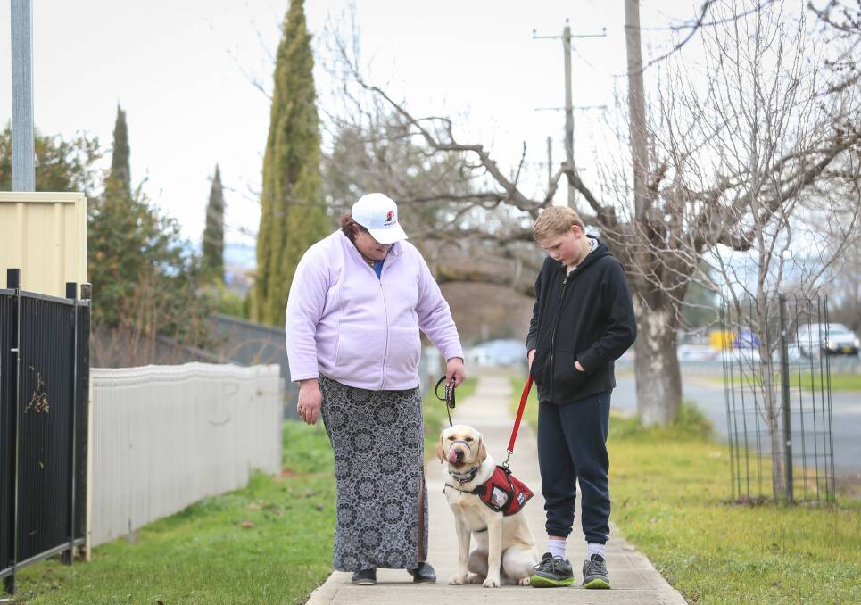 WALKING TOGETHER: Mother Belinda Moore is the handler for Gordy when her and Corey are out in the community.