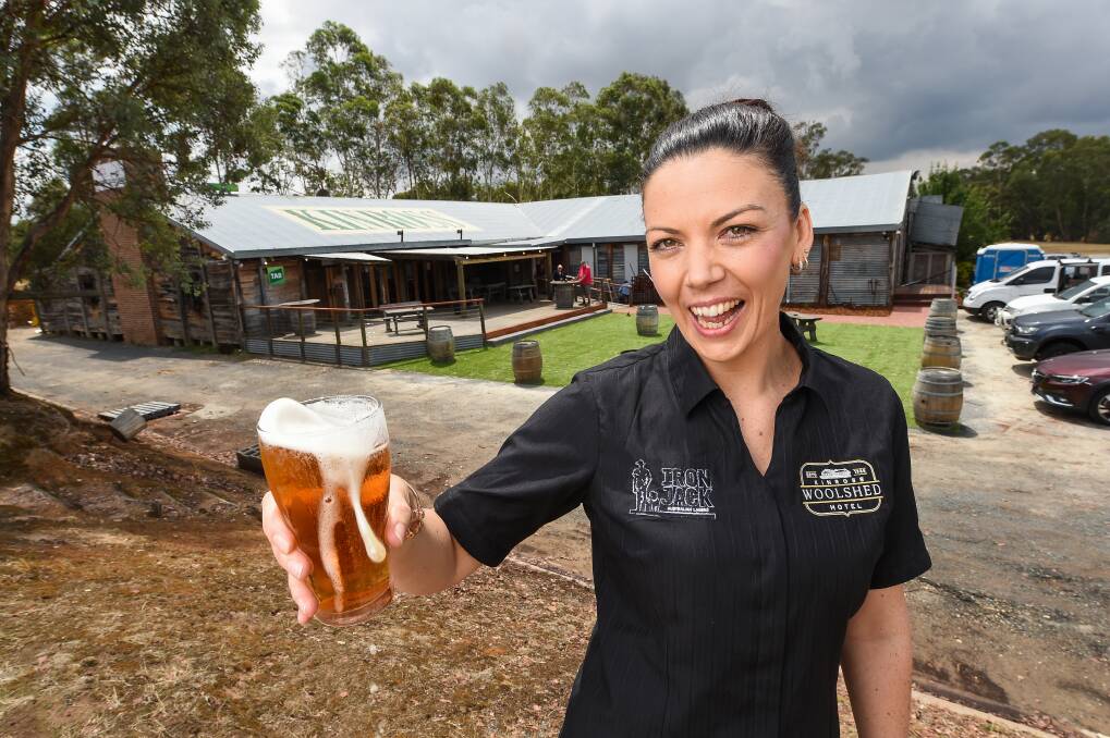 CHEERS: Kinross Woolshed venue manager Lauren Morris celebrates the opening of the Thugoona pub yesterday. Picture: MARK JESSER