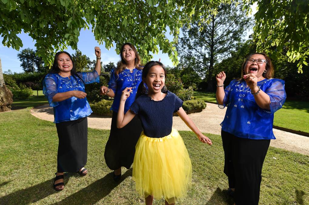 CELEBRATION: Zeph Uy, 9, dances with Carly McDonald, Rica Uy and Luisa Frank in preparation for Paskong Pilipino. Picture: MARK JESSER