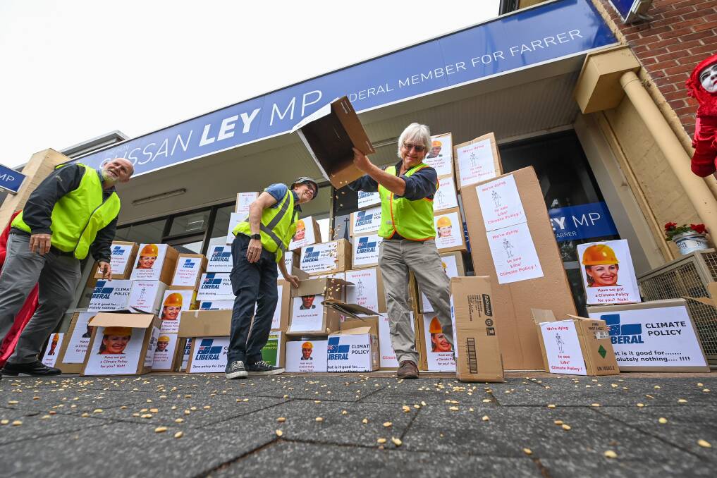 SYMBOLIC: Boxes labelled 'Liberal's climate policy' were delivered to Sussan Ley's office. The boxes which were filled with peanuts were emptied onto the pavement. 
