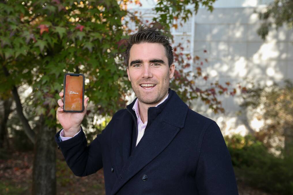 IN THE PALM OF YOUR HAND: Zukaz media and marketing manager Liam Scammell with the Zukaz app. Picture: TARA TREWHELLA