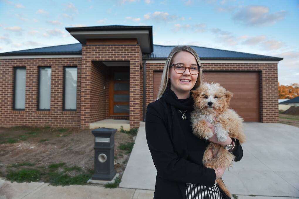 HOME: Leah Gabriel and her partner Douglas Fox have been in their new home since March with their puppy Thatcher. Picture: MARK JESSER
