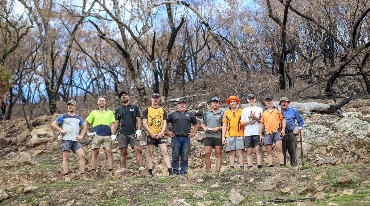 HARD WORK: Albury Tigers footballers chipped in with the clean up and some fencing work on Saturday. 