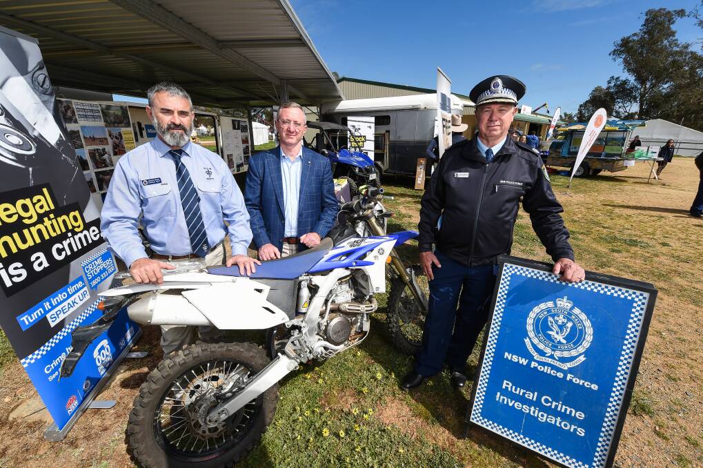 Detective Sergeant Damian Nott, Crime Stoppers, Director Peter Price and NSW Police Assistant Commissioner Geoff McKechnie. Picture: MARK JESSER