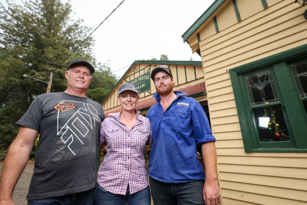 IN IT TOGETHER: Bridge Hotel Jingellic owners Glenn and Jacki Elliott with their firefighting son Tom have been working to get the country pub back up and running for their community who have 'lost so much'. Pictures: JAMES WILTSHIRE