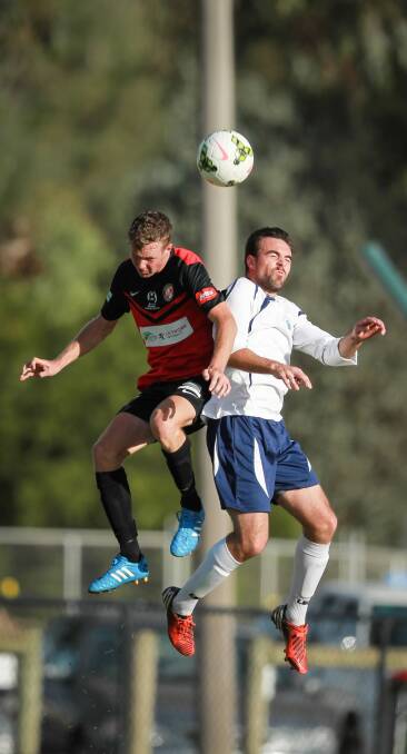 Murray United’s Adam Waters contests with Brunswick’s James Duvcevski.