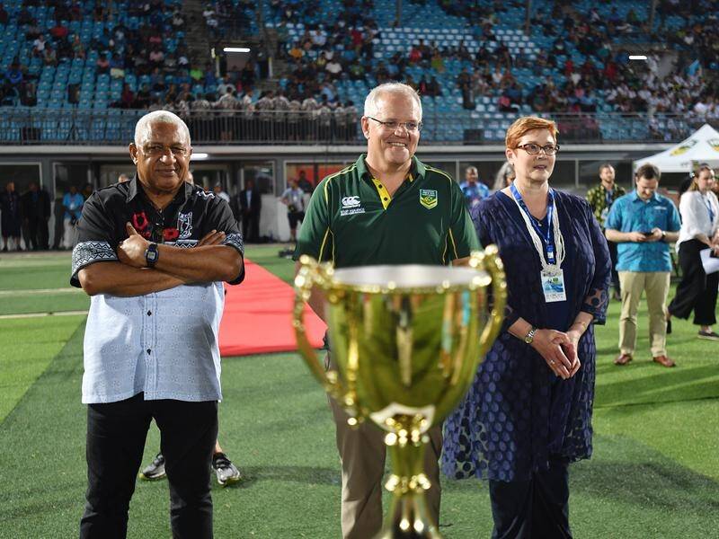 Prime Minister Scott Morrison (C) says Fiji will play NSW reserve grade rugby league in 2021.